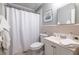 Clean bathroom featuring a shower, sink, toilet, and neutral tile work at 520 Park Se Ave # 10, Atlanta, GA 30312