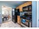 Efficient kitchen with stainless steel appliances, wood cabinets and view to the dining area at 520 Park Se Ave # 10, Atlanta, GA 30312