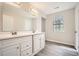 Updated bathroom features a double sink vanity, large mirror, and modern fixtures at 714 Post Road Dr, Stone Mountain, GA 30088