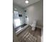 Modern bathroom featuring a glass shower door, black hardware, and sleek tile flooring at 714 Post Road Dr, Stone Mountain, GA 30088