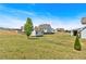 View of the home's backyard, with storage building, lawn, and partial fence visible at 95 Summerlyn Dr, Hiram, GA 30141