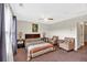 Bright bedroom featuring two chairs, side tables, and lamps at 95 Summerlyn Dr, Hiram, GA 30141