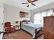 Cozy bedroom with a ceiling fan, natural light, and a comfortable bed and chair at 95 Summerlyn Dr, Hiram, GA 30141