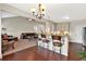 Open kitchen with bar seating overlooking the living room, granite counters, and modern lighting at 95 Summerlyn Dr, Hiram, GA 30141