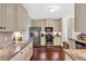 Well-equipped kitchen with stainless steel appliances, granite countertops, and wood flooring at 95 Summerlyn Dr, Hiram, GA 30141