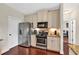 Functional kitchen with stainless steel appliances, granite countertops, and wood floors at 95 Summerlyn Dr, Hiram, GA 30141