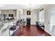Eat-in kitchen features granite counters, stainless appliances, hardwood floors, and cozy eat-in bench at 95 Summerlyn Dr, Hiram, GA 30141