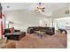 Large living room featuring a stone fireplace, vaulted ceiling, and a cozy sectional sofa at 95 Summerlyn Dr, Hiram, GA 30141