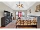 Spacious main bedroom with a tray ceiling, ceiling fan, and lots of natural light at 95 Summerlyn Dr, Hiram, GA 30141