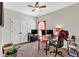 Spacious office with a ceiling fan, natural light, closet, and modern computer setup at 95 Summerlyn Dr, Hiram, GA 30141