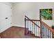 Staircase with dark wood trim and carpeted steps at 95 Summerlyn Dr, Hiram, GA 30141