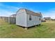 Exterior view of backyard storage shed with a double door and a gable roof at 95 Summerlyn Dr, Hiram, GA 30141
