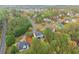 Scenic aerial view of a quiet neighborhood nestled among lush greenery at 104 Puckett Creek Dr, Canton, GA 30114