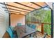 Back deck featuring a dining area with a pergola, privacy curtains, and overhead lights at 104 Puckett Creek Dr, Canton, GA 30114