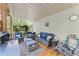 Covered back porch featuring comfortable seating and an outdoor sink area at 104 Puckett Creek Dr, Canton, GA 30114