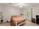 This is a bedroom with a ceiling fan, window, carpeted floor and closet at 104 Puckett Creek Dr, Canton, GA 30114