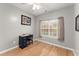 Cozy bedroom featuring a small desk, chair, and a large window for natural light at 104 Puckett Creek Dr, Canton, GA 30114
