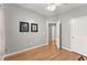 Spare bedroom with light walls, hardwood floors, and good natural light at 104 Puckett Creek Dr, Canton, GA 30114