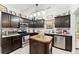 Well-lit kitchen with stainless steel appliances and a center island at 104 Puckett Creek Dr, Canton, GA 30114