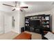 This is the living room with large built-in shelving and a ceiling fan at 104 Puckett Creek Dr, Canton, GA 30114