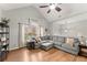Inviting living room boasts a vaulted ceiling, and plush seating at 104 Puckett Creek Dr, Canton, GA 30114