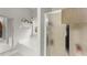 This is the main bathroom, with a large soaking tub with a window, and a glass-enclosed shower at 104 Puckett Creek Dr, Canton, GA 30114