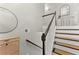 Bright staircase featuring modern design and stylish accents with a unique wall mirror at 104 Puckett Creek Dr, Canton, GA 30114
