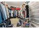 Large walk-in closet features shelving, hanging racks, and drawer space to store all your clothes at 104 Puckett Creek Dr, Canton, GA 30114