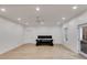 Finished basement with a ceiling fan, recessed lighting, and space for recreation plus access to the exterior at 1409 Northgate Dr, Villa Rica, GA 30180