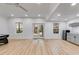 Spacious basement area featuring light wood flooring, recessed lighting, and a convenient wet bar at 1409 Northgate Dr, Villa Rica, GA 30180