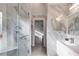 Ensuite bathroom featuring marble walls and floors and a glass shower at 1409 Northgate Dr, Villa Rica, GA 30180