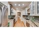 Bright kitchen featuring stainless steel appliances and white cabinets at 1409 Northgate Dr, Villa Rica, GA 30180