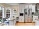 Charming kitchen featuring granite countertops, stainless steel appliances, and breakfast bar at 1409 Northgate Dr, Villa Rica, GA 30180