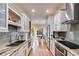 Modern kitchen features white cabinets, granite countertops and stainless steel appliances at 1409 Northgate Dr, Villa Rica, GA 30180