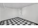 Basement with black and white checkered flooring, white walls and a single window at 235 The Prado N, Atlanta, GA 30309
