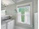 Charming bathroom vanity with granite counters, mirror, and natural light at 235 The Prado N, Atlanta, GA 30309