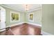 Bedroom with hardwood floors, natural light from two windows, and neutral wall color at 235 The Prado N, Atlanta, GA 30309