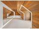 Unique room with white carpet, wood paneled walls, and vaulted wood paneled ceiling at 235 The Prado N, Atlanta, GA 30309