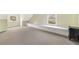 Bright bedroom featuring a long window seat, neutral carpet and two windows at 235 The Prado N, Atlanta, GA 30309