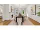 Bright dining room featuring a chandelier, fireplace, and large windows with draperies at 235 The Prado N, Atlanta, GA 30309