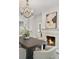 Elegant dining room showcasing a fireplace, chandelier, and stylish decor at 235 The Prado N, Atlanta, GA 30309