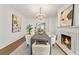 Elegant dining room with fireplace, chandelier and sophisticated decor at 235 The Prado N, Atlanta, GA 30309