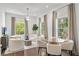Bright living room features a round table and chairs, plus large windows at 235 The Prado N, Atlanta, GA 30309