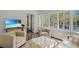 Inviting living room with beach view on TV screen and plush seating at 235 The Prado N, Atlanta, GA 30309
