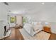 Bright bedroom features a fireplace, ceiling fan, and bedside table with marble countertop at 235 The Prado N, Atlanta, GA 30309