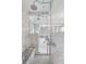 Elegant walk-in shower featuring dual showerheads and bench at 235 The Prado N, Atlanta, GA 30309