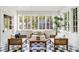 Cozy sunroom filled with natural light and stylish furniture, creating a relaxing space at 235 The Prado N, Atlanta, GA 30309