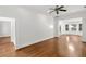Bright living room with hardwood floors, white trim, and a large bay window at 235 The Prado N, Atlanta, GA 30309