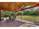 Outdoor living space with brick floors, ceiling fan, and outdoor dining set at 3113 Octavia Pl, Atlanta, GA 30340