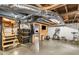 Unfinished basement featuring stairs, storage containers, exposed ductwork, and exercise equipment at 3113 Octavia Pl, Atlanta, GA 30340